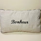 Coussin en lin brodé "Bonheur"